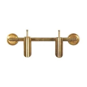 Double sconce with aged patina brass finish featuring two spotlight-style adjustable shades on a horizontal bar