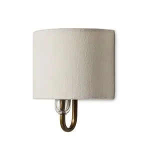 Wide half dome cream cotton shade sconce with curved antique brass-finished iron arm and glass socket