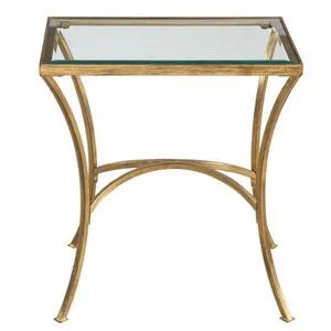 Gold end table with gracefully arched hand-forged iron legs and clear beveled tempered glass top