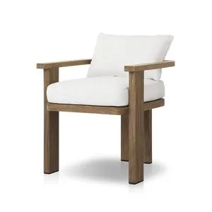 Tahana Outdoor Dining Armchair with three-leg wood frame and curved seat back, white cushioned seat and knife-edge back cu...