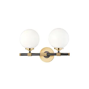 Bowery 2 Light Bath Bracket with dual white globe shades on a black and brass horizontal bar with brass circular wall mount