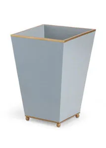 Pastel blue square wastebasket with gold trim along top edge and gold ball feet