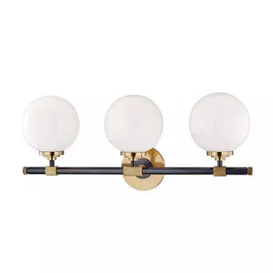 Three-light bath bracket with frosted glass globe shades and brushed gold and black metal bar fixture