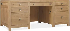 Driftwood Executive Desk in Buckboard oak finish with seven drawers, drop-front keyboard tray, and silver knobs