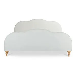 Cream upholstered Jacqueline bed with gently waved headboard and footboard, and natural ash stacked legs.