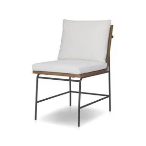 Outdoor dining chair with black iron frame, natural teak ladderback, and cream linen-blend cushions