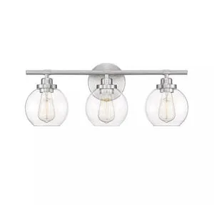 Front view showing symmetrical alignment of the three clear glass fishbowl shades on satin nickel fixture