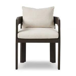 Jackson Outdoor Metal Dining Chair with barrel back, dark metal frame, beige crisp upholstery cushions