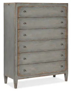 Six-drawer speckled gray chest with distressed finish and rounded corners on drawers and tapered legs