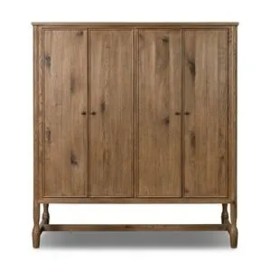 Bari Wide Cabinet with four paneled doors in rustic wood finish and round dark knobs on raised legs