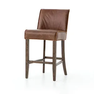 Aria Bar + Counter Stool with raw-edged top-grain brown leather seat and flared dark wooden legs