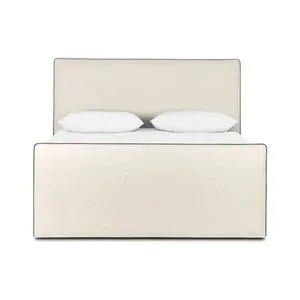 Upholstered bed in light Crypton® fabric with streamlined design and brown contrast piping